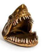 Bronze shark head sculpture on a white background