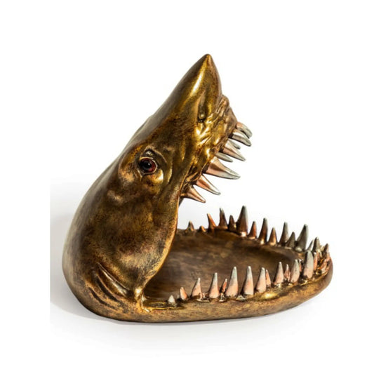 Bronze shark head sculpture on a white background