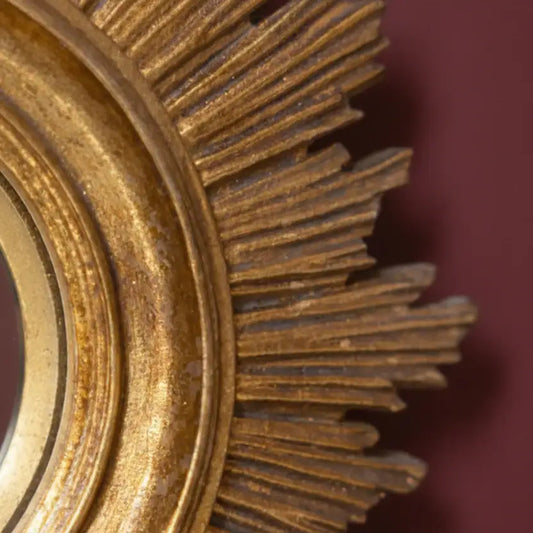 Close-up of a rusty metal gear on a dark background