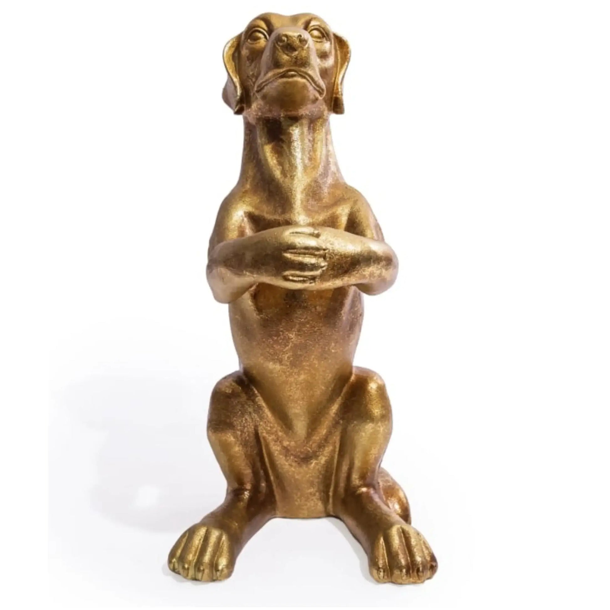 Bronze statue of a dog with arms crossed on a white background