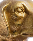 Close-up of a bronze statue with detailed facial features