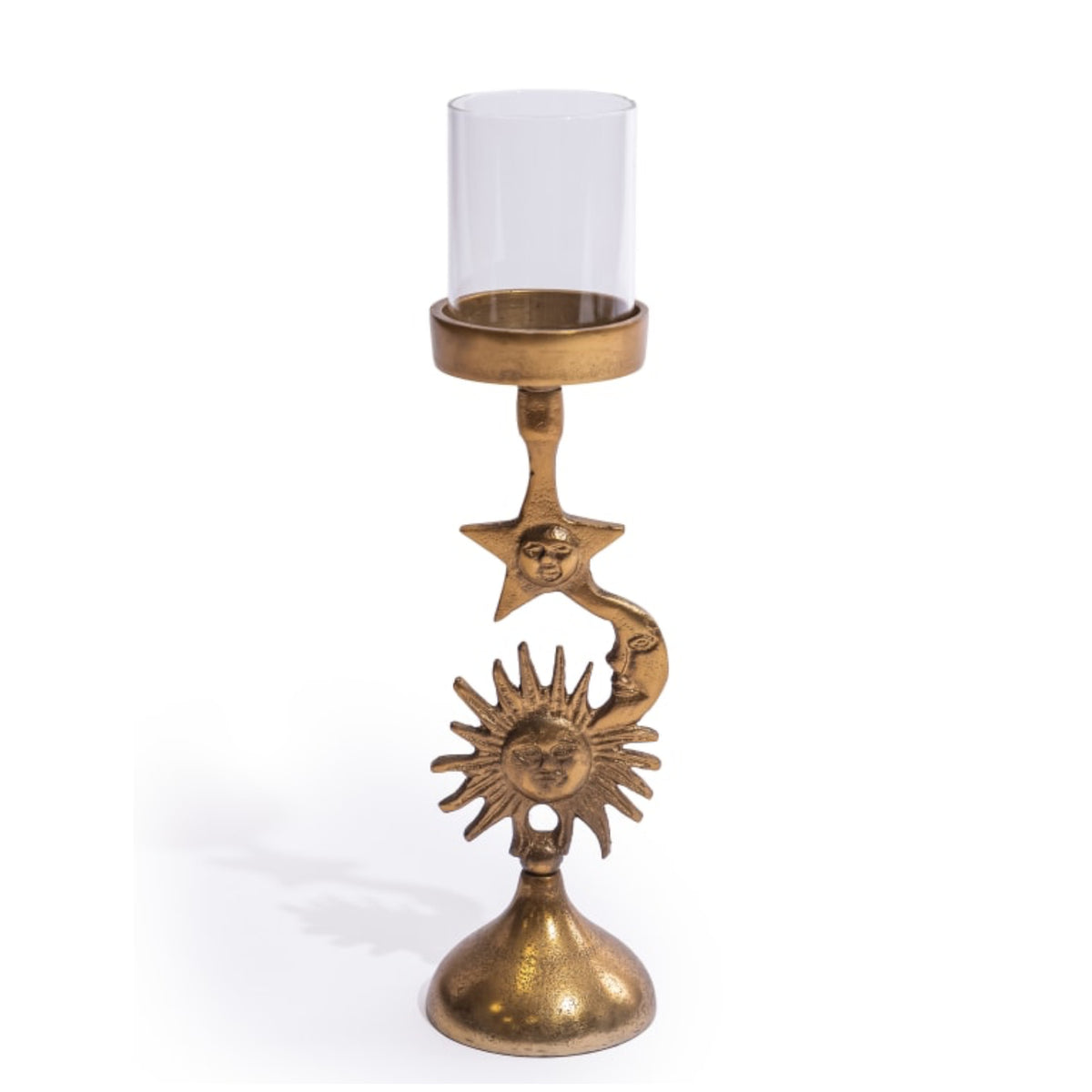 A decorative brass candle holder with a clear glass candle sleeve, featuring celestial sun and moon faces on a white background.