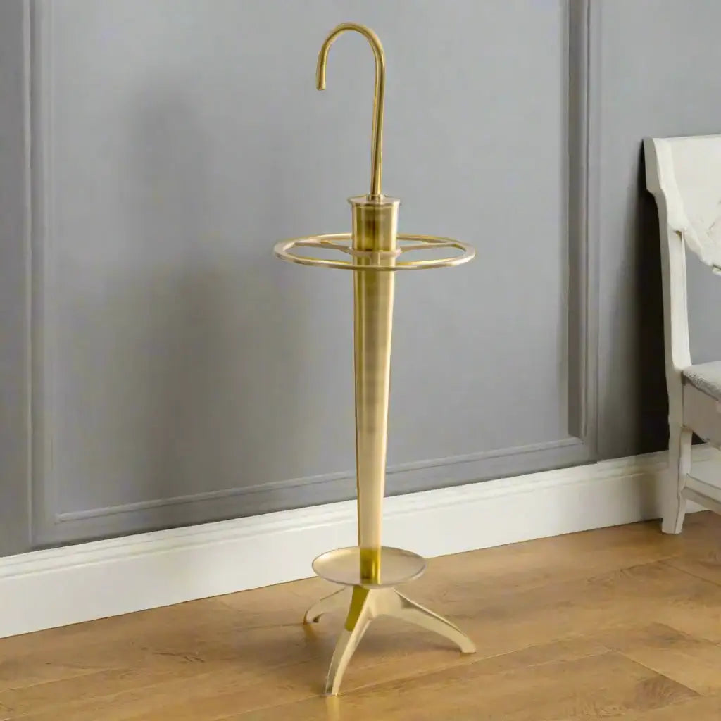 Brass umbrella stand on a white background