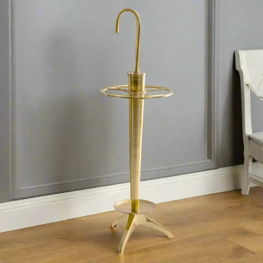 Brass umbrella stand on a white background