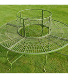 Decorative metal garden table on a grassy background