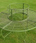 Decorative metal garden table on a grassy background