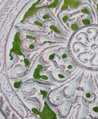 Close-up of a decorative ceramic plate with intricate patterns