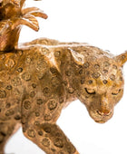 Bronze panther figurine with intricate detailing on a white background