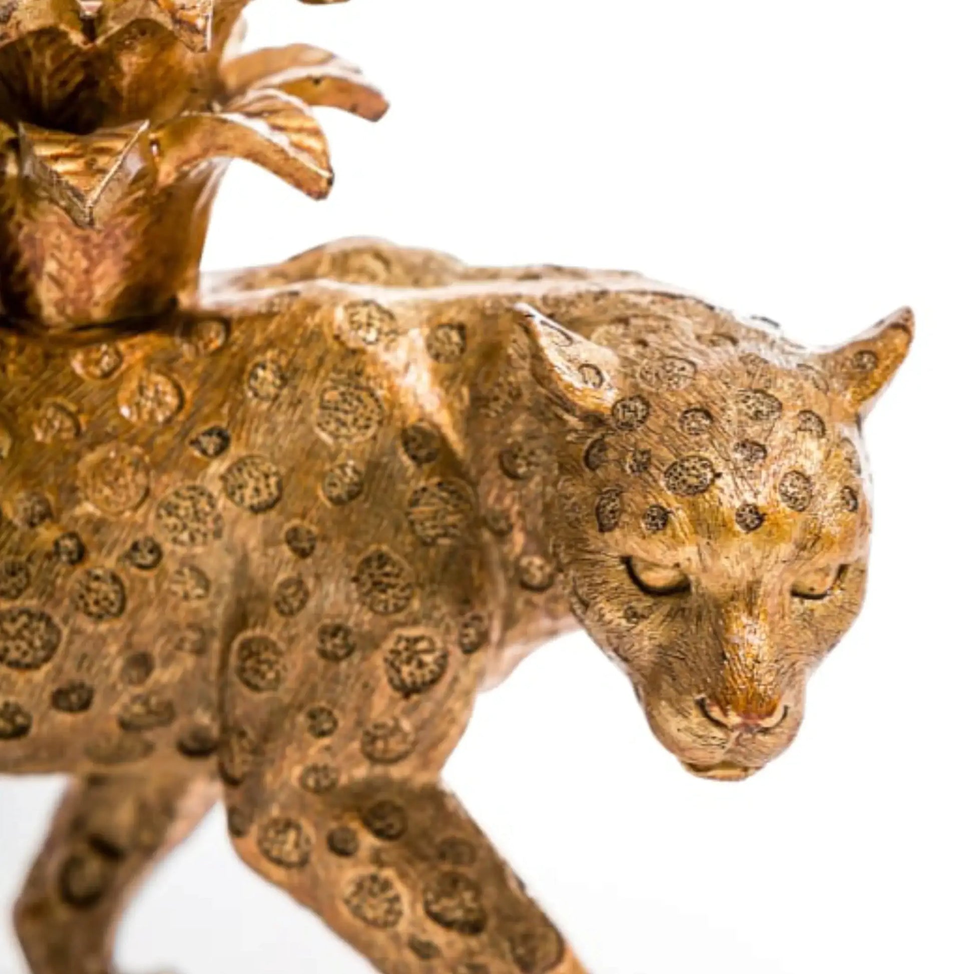 Bronze panther figurine with intricate detailing on a white background