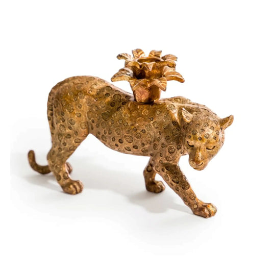 Bronze leopard figurine with a flower-shaped object on its back against a white background