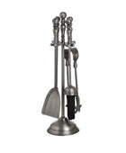 Set of four metal fireplace tools on a white background