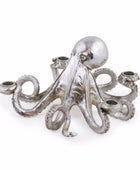 A silver octopus-shaped candle holder with six tentacles, each ending in a cup, photographed on a clean white background.
