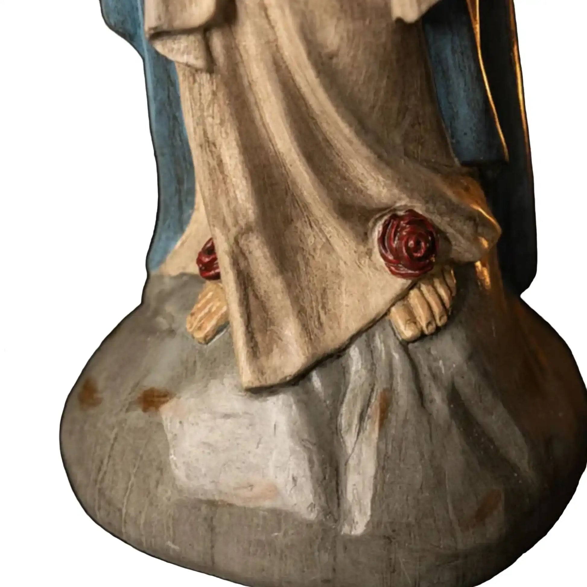 Wooden statue of a religious figure with a blue garment and gray skirt on a white background