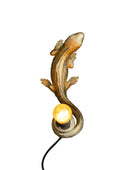Lizard-shaped lamp with a light bulb on a white background