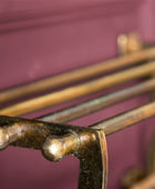 Close-up of a rusty metal grill grate against a dark background