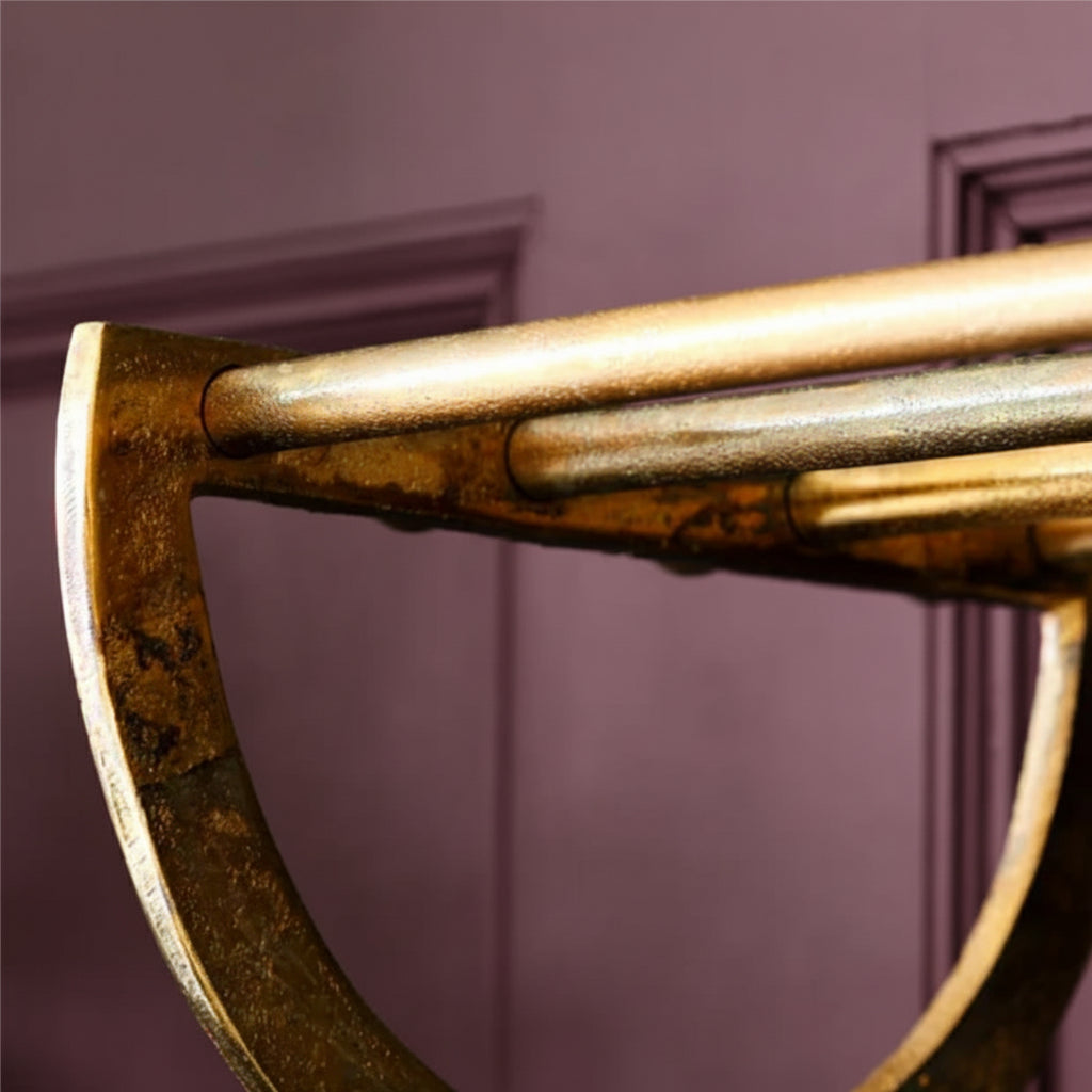 Close-up of a bronze axe head against a gray background