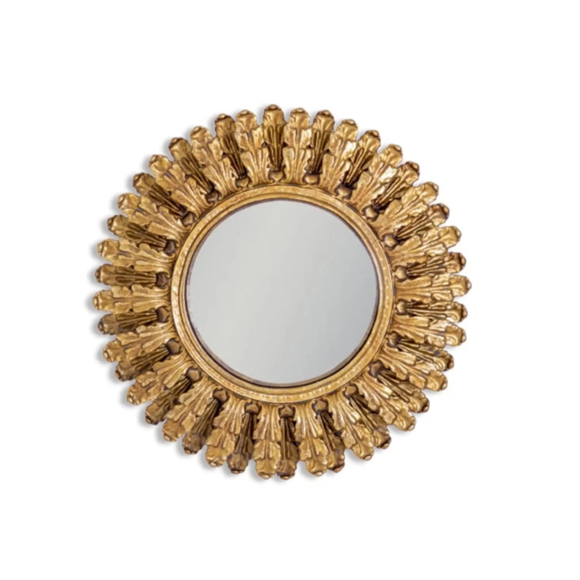Decorative gold mirror with sunburst design on a white background
