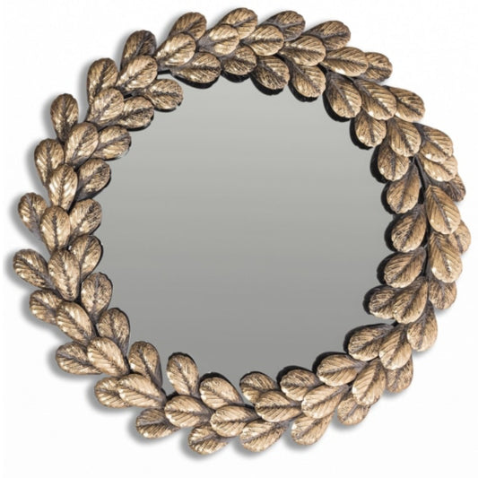 Round mirror with leaf-like gold frame on a white background