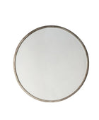 Round mirror with a metallic frame on a white background
