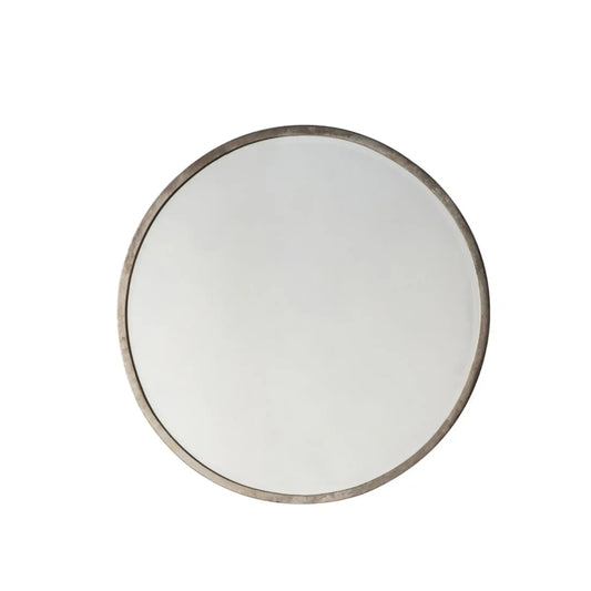 Round mirror with a metallic frame on a white background
