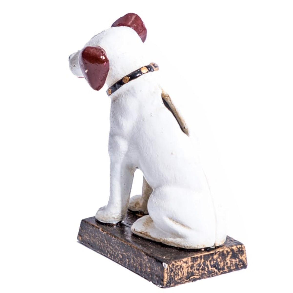 A small white dog figurine with dark reddish-brown ears and eyes, wearing a black and gold collar, sitting on a distressed dark brown rectangular base against a plain white background.