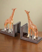 Giraffe bookends on a white background