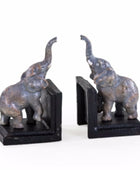 Two elephant bookends on a white background