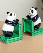 Two panda bookends on a white background