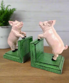 Two pig-shaped bookends on a white background