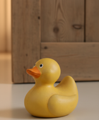 Yellow rubber duck on a wooden floor