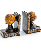Pair of decorative bookends with globe design on a white background
