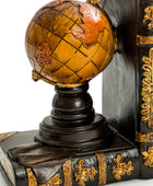 Decorative bookend with globe on top against a white background