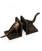 Bronze dinosaur bookends on a white background