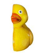 A classic yellow rubber duck toy with a glossy finish, featuring a bright orange beak and a detailed white eye with a black pupil, isolated on a solid white background.