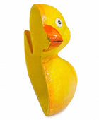 A hand-painted wooden duck toy in bright yellow with an orange beak and a white eye, shown against a plain white background.