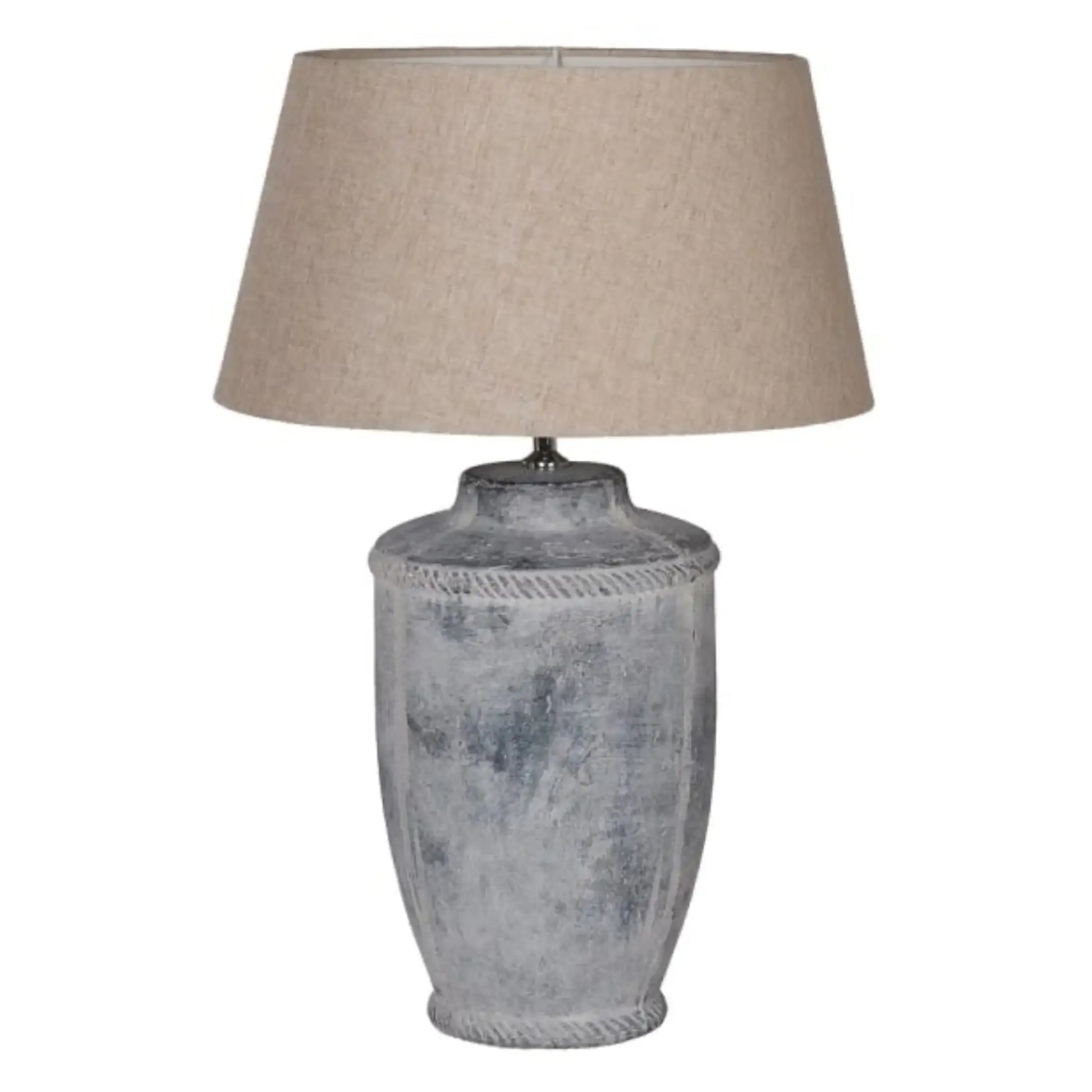 Table lamp with textured gray base and beige lampshade on a white background