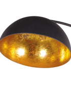 Black and gold lamp with a white background