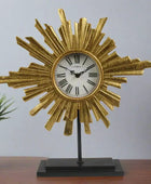 Decorative clock with sunburst design on a stand against a gray background