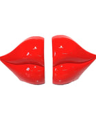Red lip-shaped objects on a white background