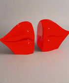 Red lip-shaped objects on a white background