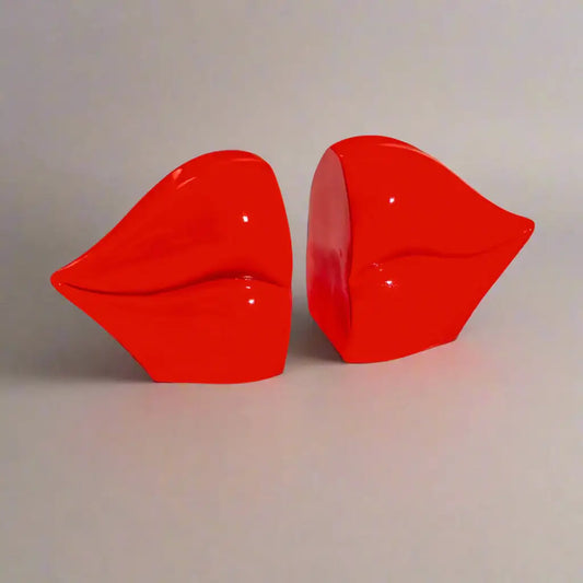 Red lip-shaped objects on a white background