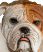Close-up of a bulldog figurine with a white and brown color pattern.