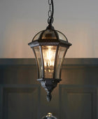 Vintage-style hanging lantern with a warm glow against a dark background