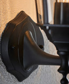Black metal door handle on a textured wall