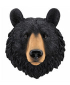 A realistic black bear head wall mount or decorative sculpture on a plain white background.
