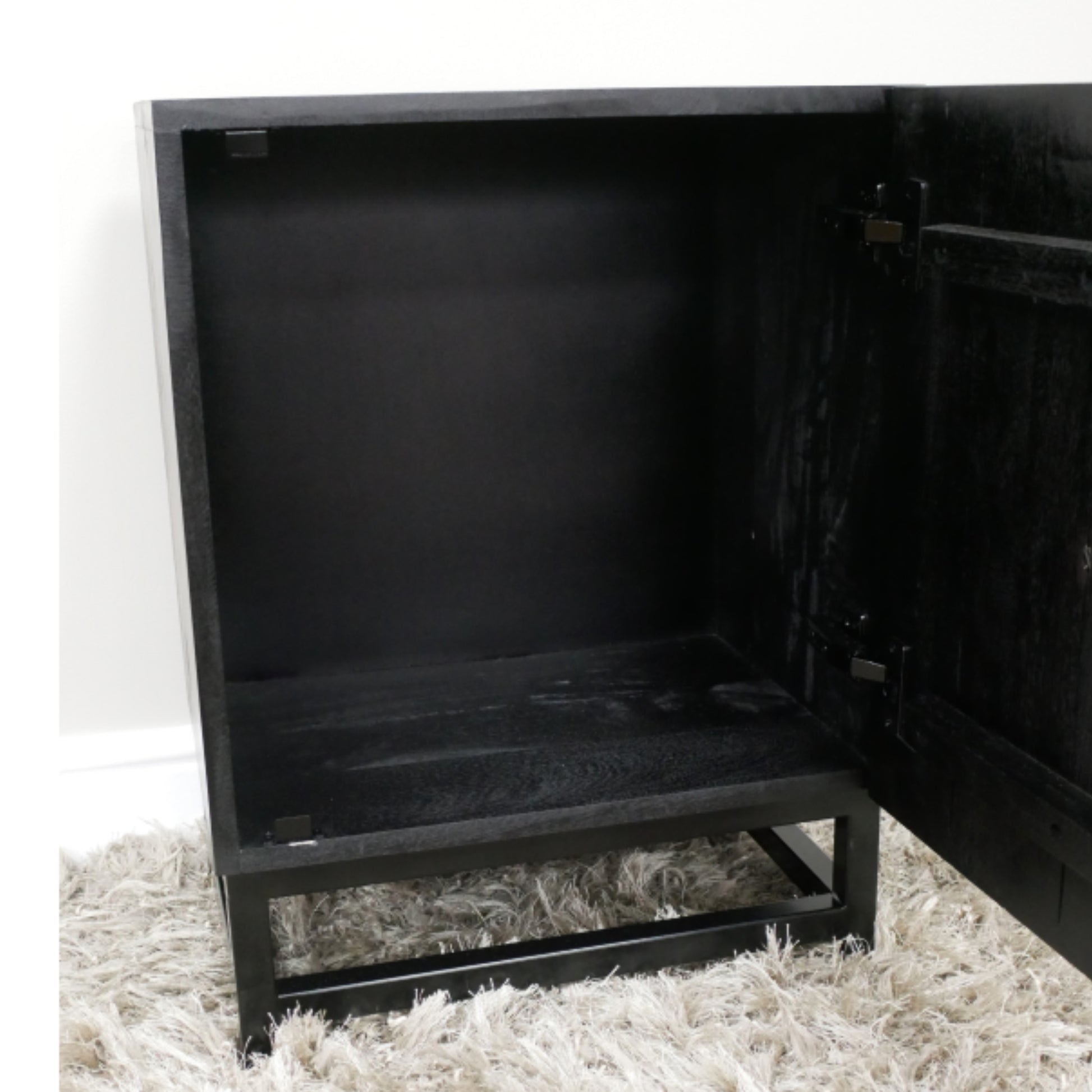 Black corner cabinet on a white background