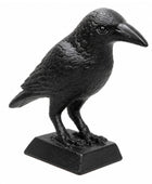 Black crow figurine on a white background