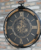 Decorative wall clock with mechanical design on a brick wall