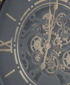 Close-up of a mechanical clock face with gears and Roman numerals.