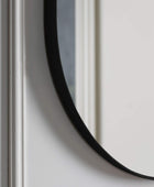 Black Oval Metal Wall Mirror - The Farthing